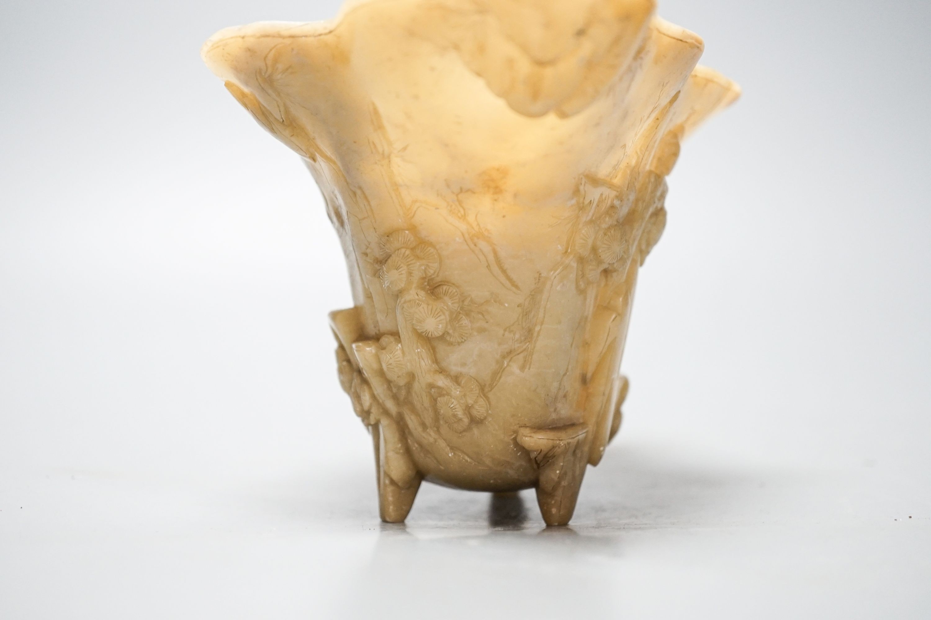 A Chinese carved soapstone libation cup, 19cm
